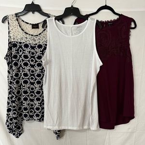 3 tops size 3x   Two are Torrid and one is from Ross. Sleeveless.